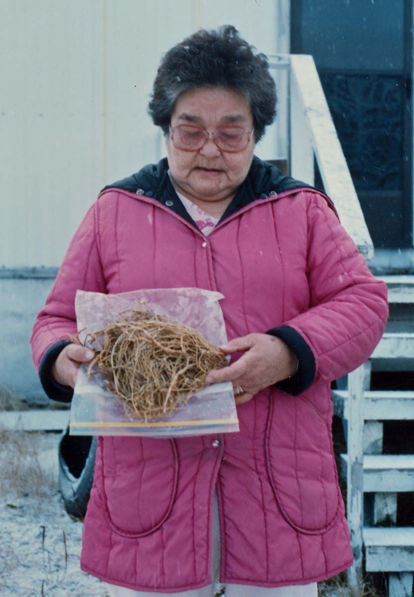 Woman with bag of nettle