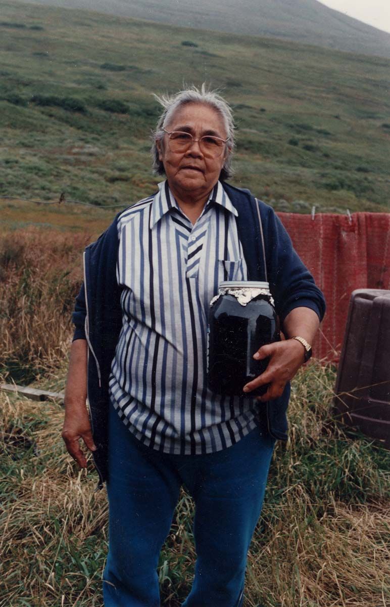 Woman with jar of blueberries