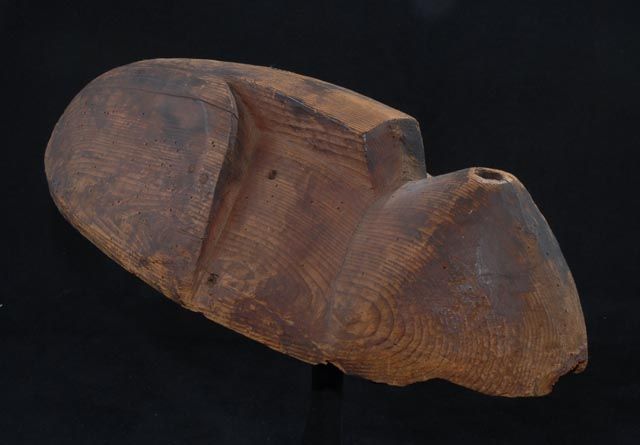 Mask with a puckered mouth, whistling.