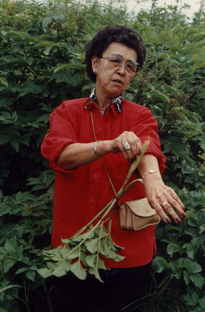 Woman rubbing angelica on her arm